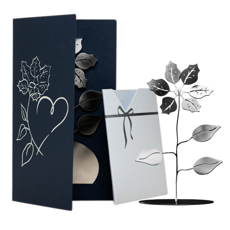 Little flower within a dark blue greeting card with light insert